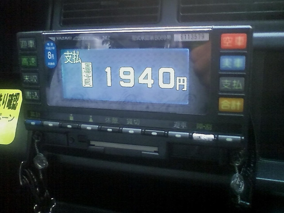 A taxi meter on a car dashboard in Japan